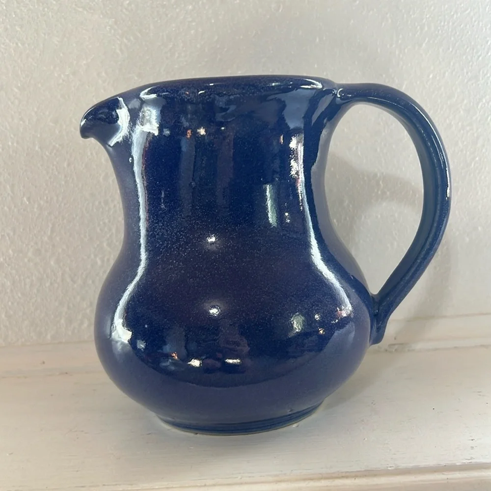 Handmade pottery pitcher blue glaze with handle